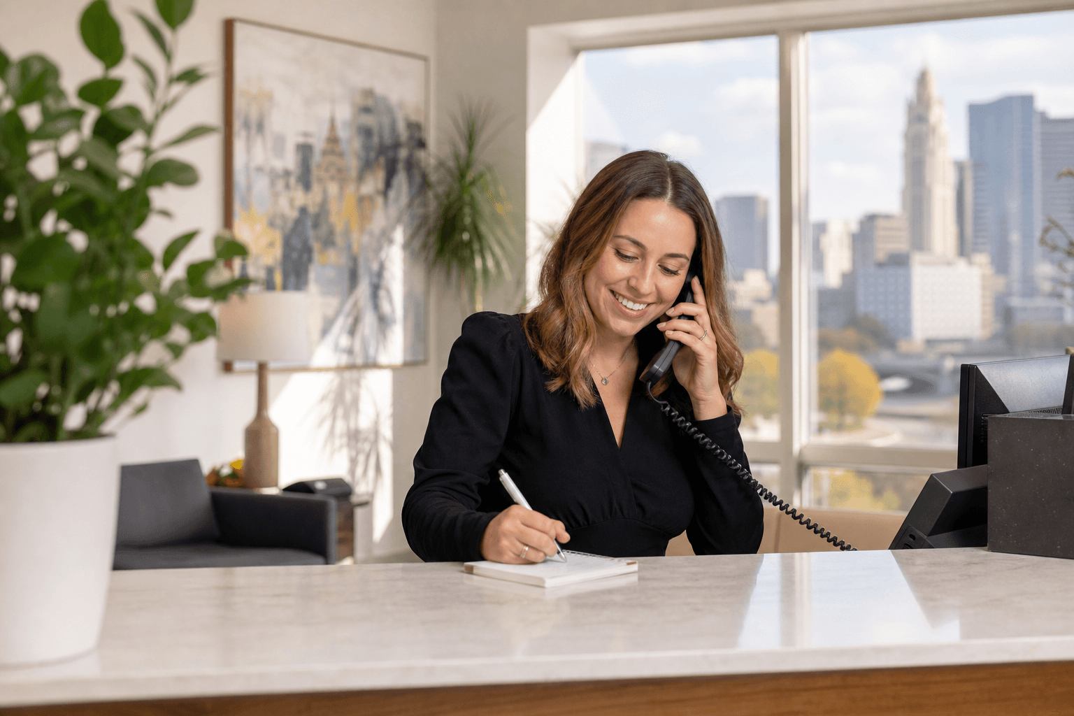 ColumbusOne team member helping a visitor at the front desk