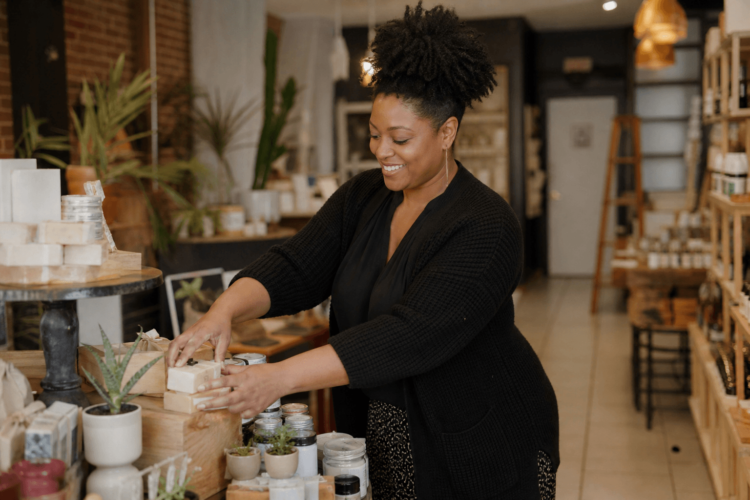 Local business owner arranging products in their shop